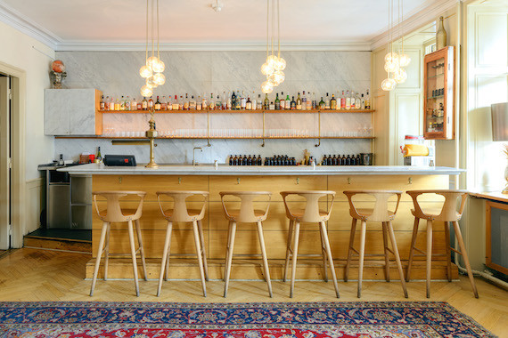 Bar interior featuring bar stools